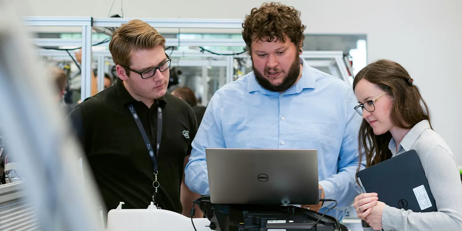 Collaboration-Acorn-Coaching-Development Three engineers collaborating on a technical project